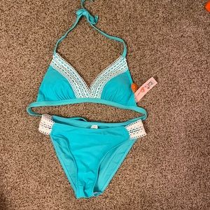 Women’s bikini, size M. New. Has removable padding on top.